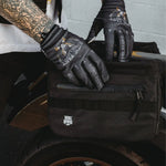 Black motorcycle saddlebag from The Doom Slinger Saddlebags with hidden waterproof pockets