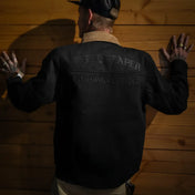 Black denim jacket with tan collar featuring conceal carry pockets made from premium selvedge denim