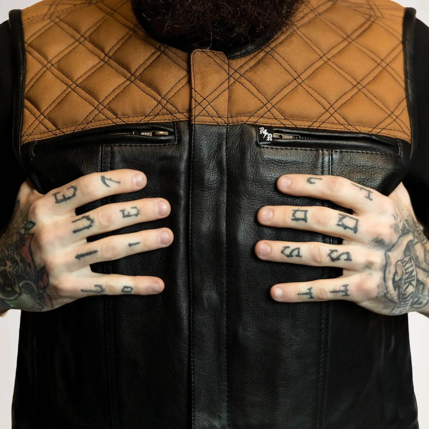 Two-toned cowhide leather vest with dual concealed carry pockets and double diamond design