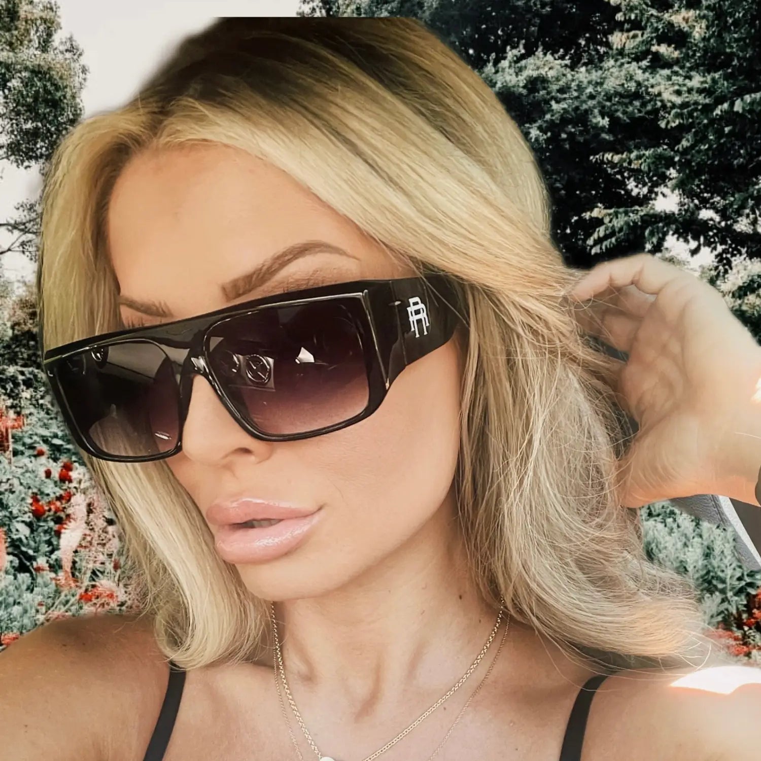 Oversized black sunglasses from Vibe Retro UV400 Sunglass Collection featuring Rebel Reaper Monogram