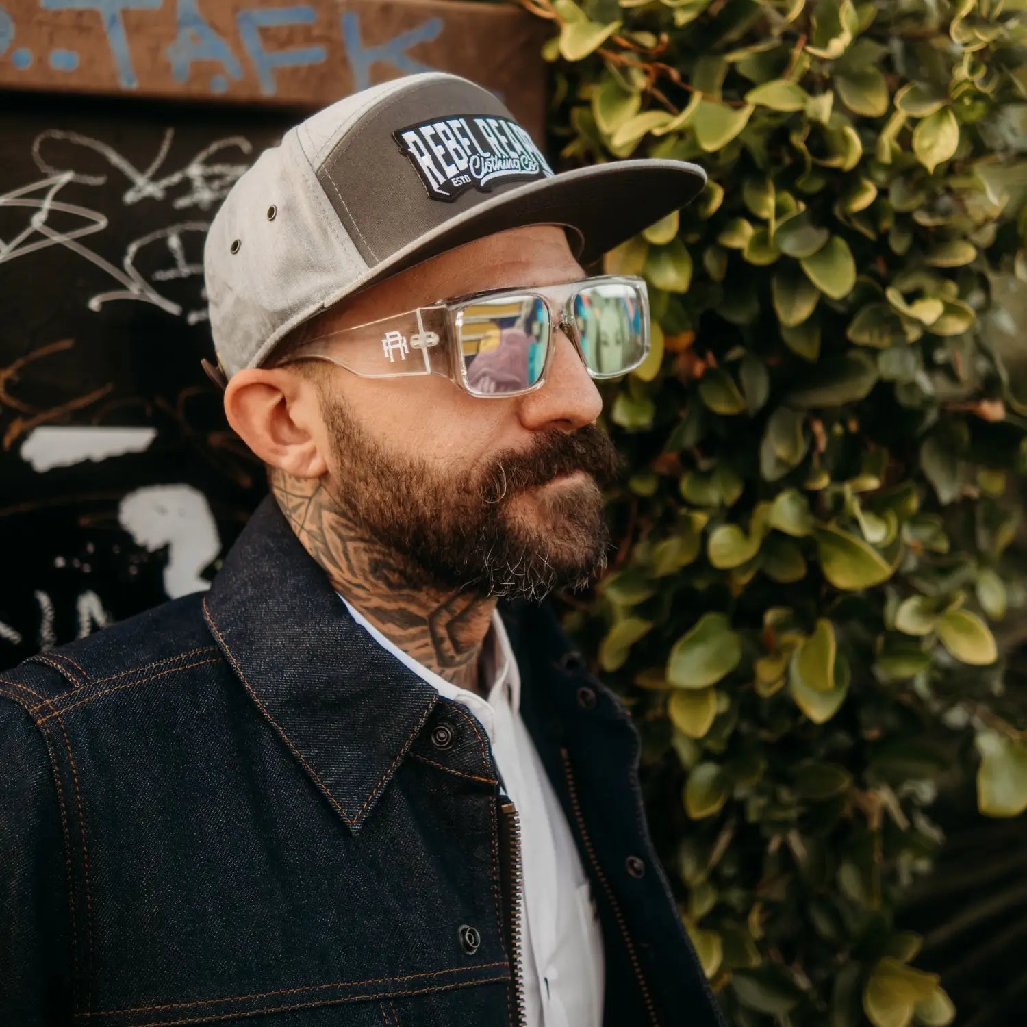 Man wearing rebel reaper monogram Vibe Retro UV400 Sunglass in stylish hat and sunglasses
