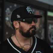 Man with beard wearing Vibe Retro UV400 Sunglass from Rebel Reaper Monogram collection