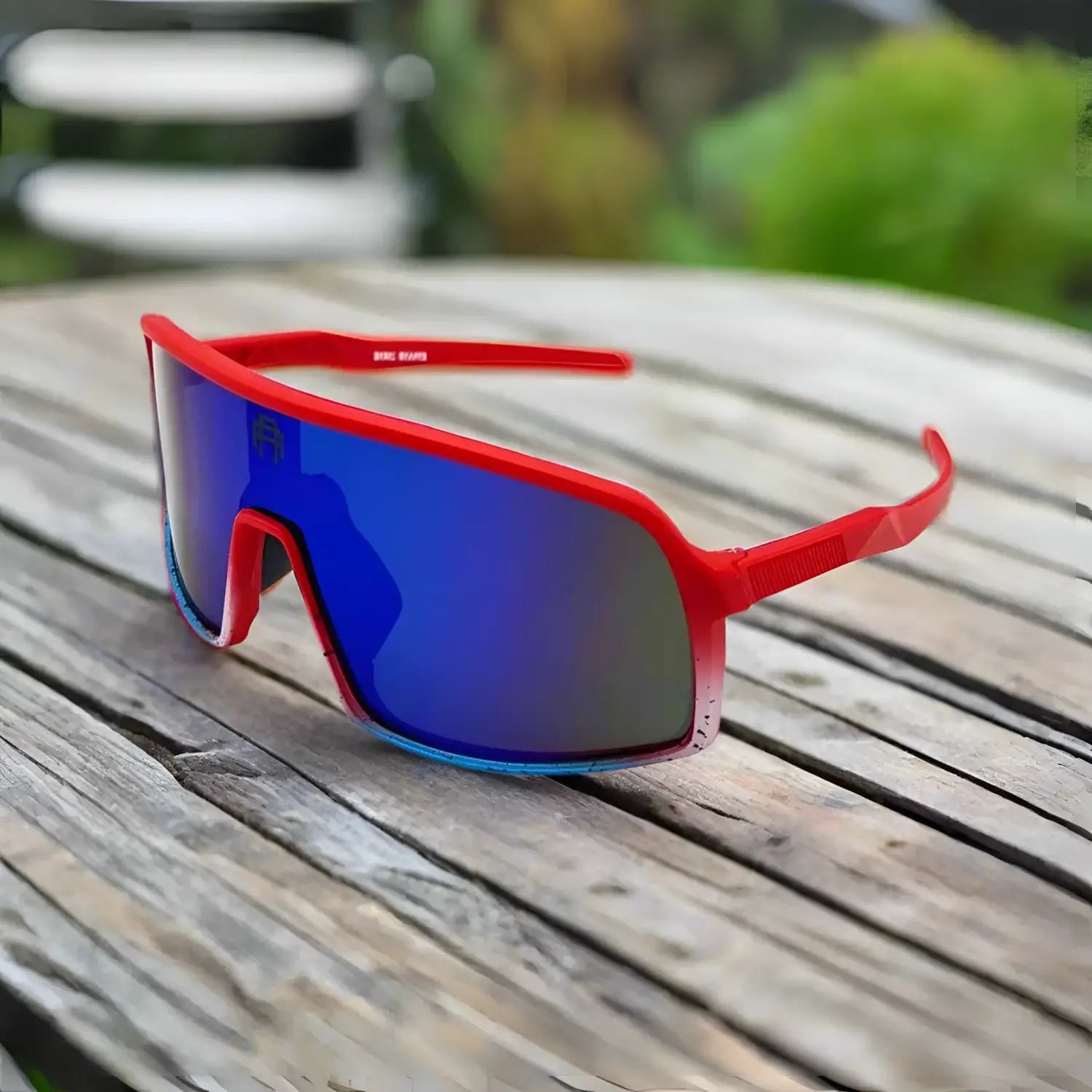 Red-framed sunglasses with blue mirrored lenses from Yeti Shield UV400 Sunglass Collection for legendary protection